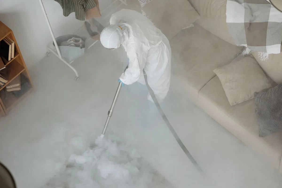 Biohazard cleanup technician in protective equipment, Frenchtown, Tallahassee, FL